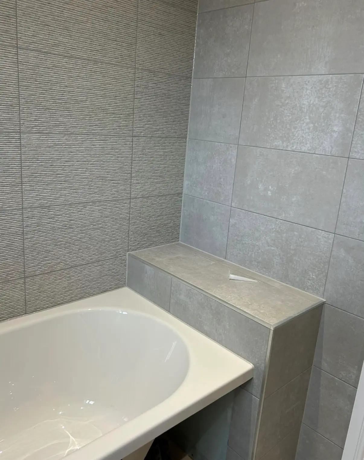 Tiled bathroom and shower tray ready for a clean sealant finish